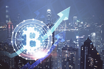 Multi exposure of cryptocurrency theme hologram drawing and city veiw background. Concept of blockchain and bitcoin.