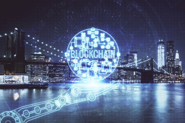 Multi exposure of cryptocurrency theme hologram drawing and city veiw background. Concept of blockchain and bitcoin.