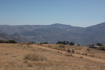 Bikepackers making their way through the mountains. 