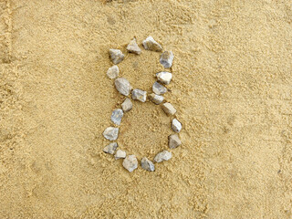 Number 8 on the sand, laid with fine gravel