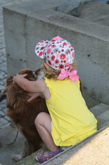 Caucasian baby outdoor with a dog