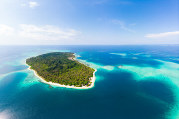 Aerial: exotic tropical island secluded destination away from it all, coral reef caribbean sea...