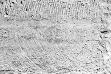 Texture of a concrete wall with cracks and scratches which can be used as a background
