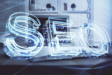 Multi exposure of table with computer and seo drawing hologram. Search optimization concept.