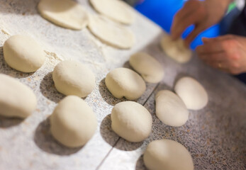 Fototapeta na wymiar Cutting dough for baking