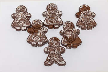 ginger cookies in the form of men on a white background