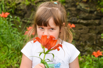 Caucasian girl outdoors with lily flowers