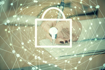 Double exposure of hands making notes with lock icons. Concept security and protection of data