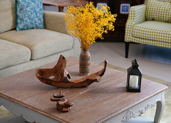 Wooden hand made house decoration on the table. Natural materials for home. Eco concept.