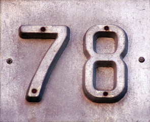 Street number iron sign with number 78.