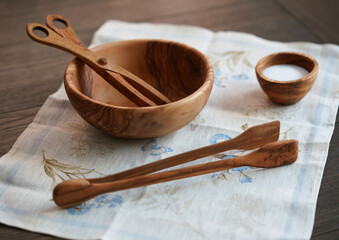 wooden salad bowl and tongs on the table. Eco kitchenware. Say no to plastic. Eco concept