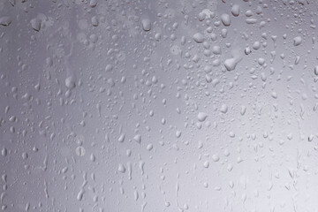 White water drops background. White water drops on a boat glass background.