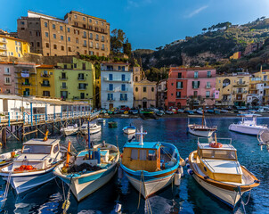 A view looking back over fishing boats of the Marina Grande, Sorrento, Italy