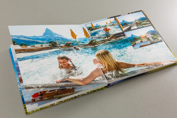 open photo book on a gray background