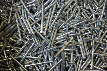 Shining bolts blue toned photo and bolts / background. Industry, metal. are used in construction.