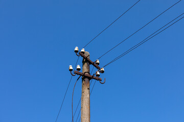 Old concrete pillar with electricity.