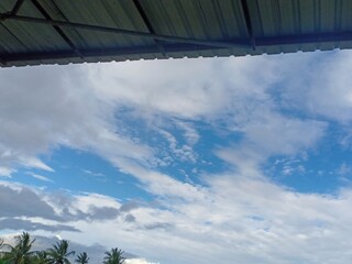 black and white clouds against a background of blue sky