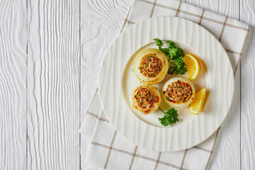a portion of baked onions stuffed with minced lamb