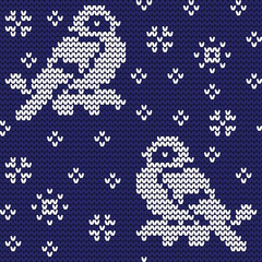 Jacquard knitted seamless pattern with cute bullfinchies, rowanberries and snowflakes. Winter background with nature and birds. Scandinavian style. Vector illustration.