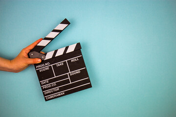 Movie clapper on blue background, cinema concept