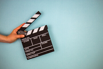 Movie clapper on blue background, cinema concept