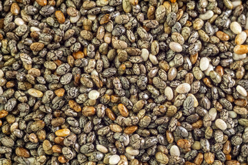 Chia seeds close-up background macro. The texture of the Chia seeds. Healthy food. Copy space.