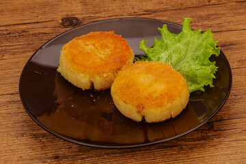 Vegan cuisine - Potato cutlet in the plate