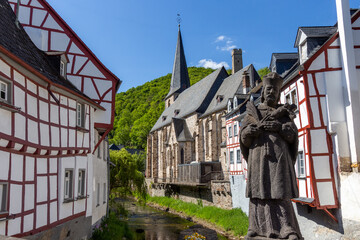 View from an old bridge on River elz and half-timbered houses in Monreal © Reiner