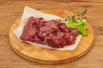 Raw chicken liver over board