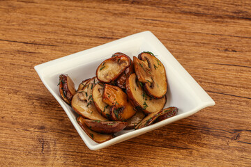 Roasted champignon with herbs and spices