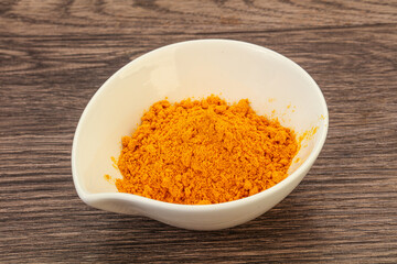 Tumeric powder in the bowl