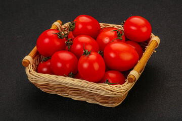 Ripe juicy cherry tomato in the bowl