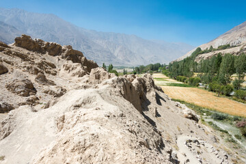 Fototapeta na wymiar Ruins of Khaakha Fortress in the Wakhan Valley in Ishkashim, Gorno-Badakhshan, Tajikistan. It is located in the Tajikistan and Afghanistan border.