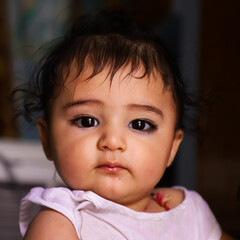 Cute Indian Kid Giving Pose To Camera With Beautiful Smile.