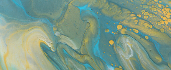 art photography of abstract marbleized effect background. Blue, green and gold creative colors. Beautiful paint.