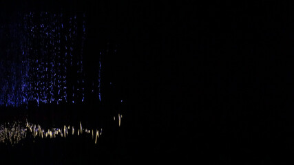 Blue and white reflection on sea at night, background