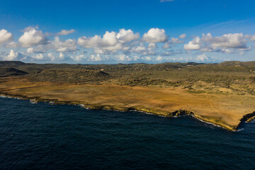 Aerial view of coast of Curaçao in Caribbean Sea with turquoise water, cliff and beautiful coral...