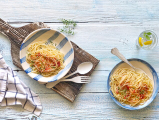 spaghetti pasta with tomato sauce on a wooden table