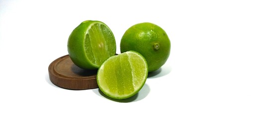 lime slides on a white background with a wooden support