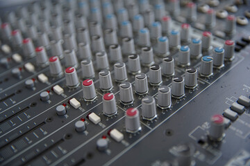 Sound amplifier and equalizer studio mixer control panel for sound recording. Selective focus.