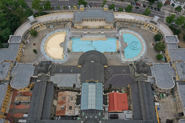 The Szechenyi Spa is one of the largest spa complexes in Europe in the Budapest City Park. Drone photo from above can be clearly seen in the thermal pool. Budapeset Hungary / June 11, 2020