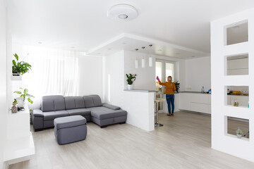 Smiling worth girl with the equipment for cleaning