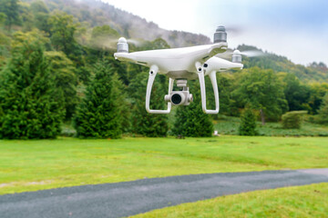White drone over a road