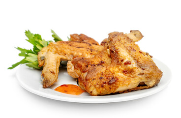 Plate with smoked chicken wings on white background.