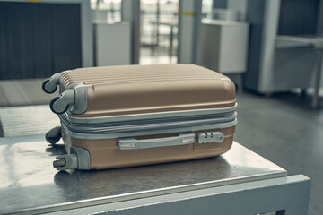 Close up of suitcase that being on conveyor belt