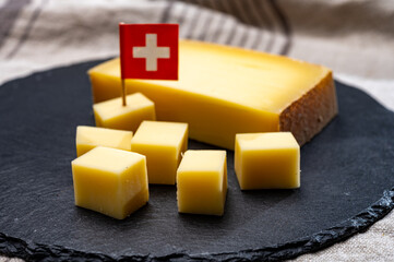 Block of Swiss medium-hard matured cheese gruyere used for baking, quiche, fondue, sandwiches