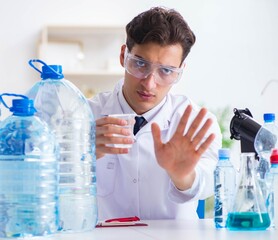 Lab assistant testing water quality