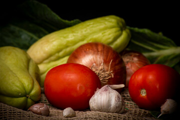 Vegetables and spices in a beautiful arrangement with black background