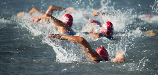 Acrylic prints Best sellers Sport Competitors swimming out into open water at the beginning of triathlon