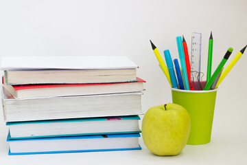 Naklejka premium school books pencils on a white background